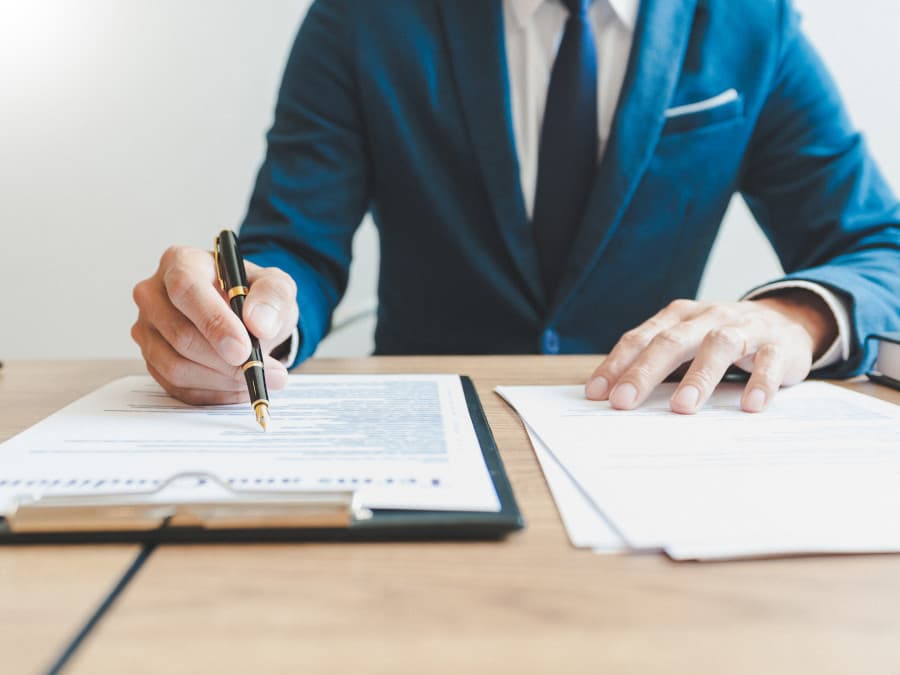 Solicitor Checking And Signing Documents
